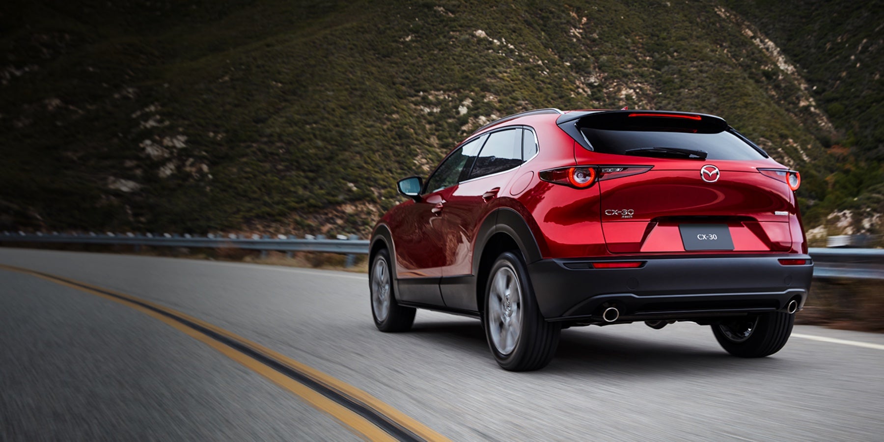 Red 2020 Mazda CX-30 Driving on the road | Bommarito Mazda St. Peters in St. Peters, MO